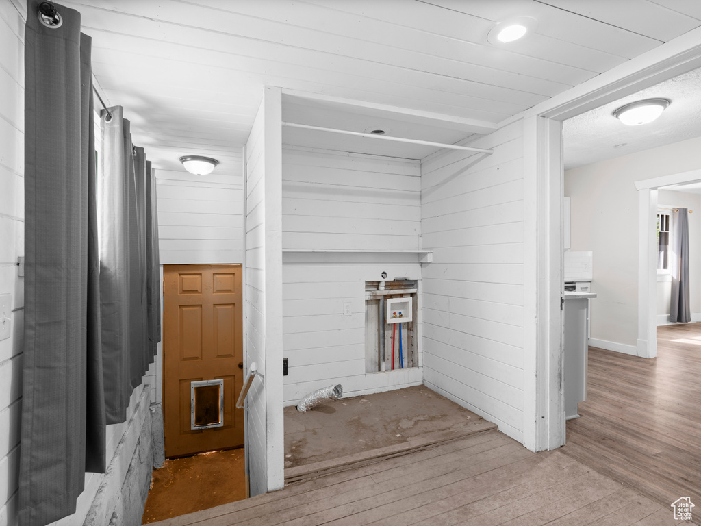 Corridor with wood finished floors
