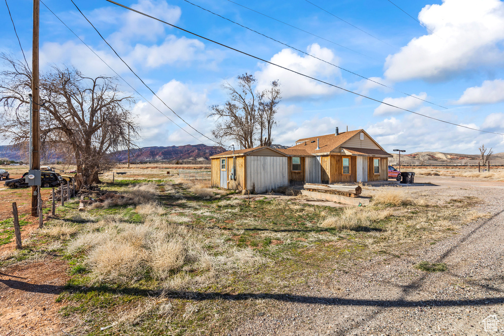 Rear view of property with a mountain view