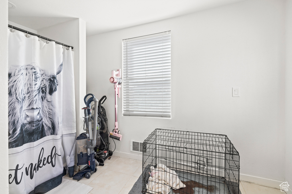 Tiled bedroom with baseboards