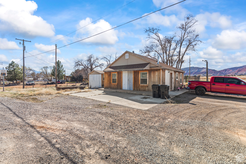 View of front of property with a mountain view