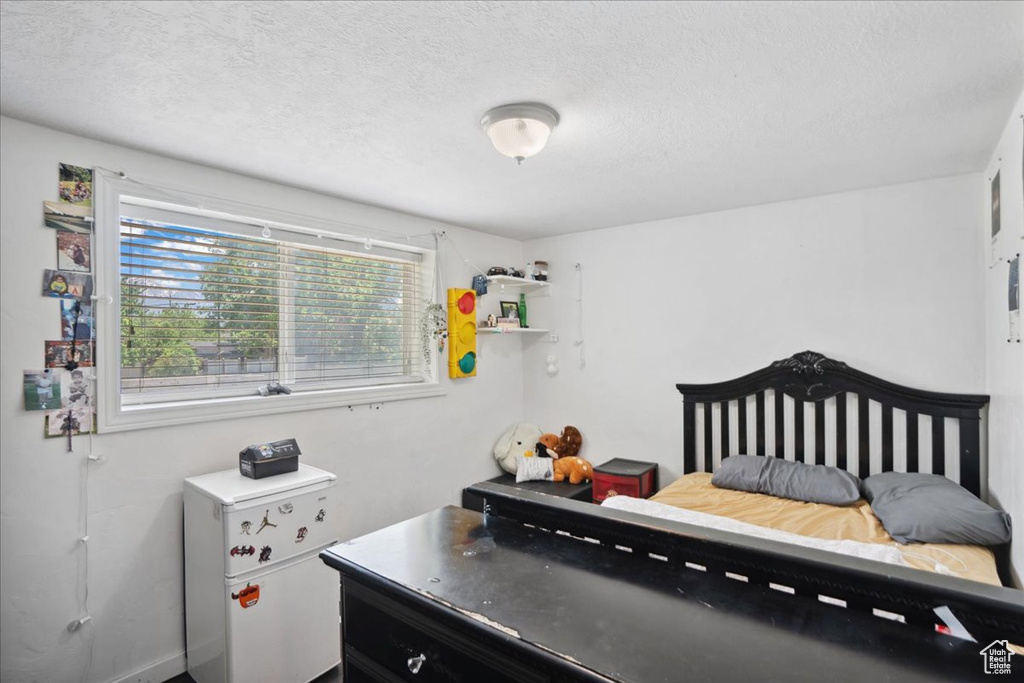 Bedroom featuring a textured ceiling