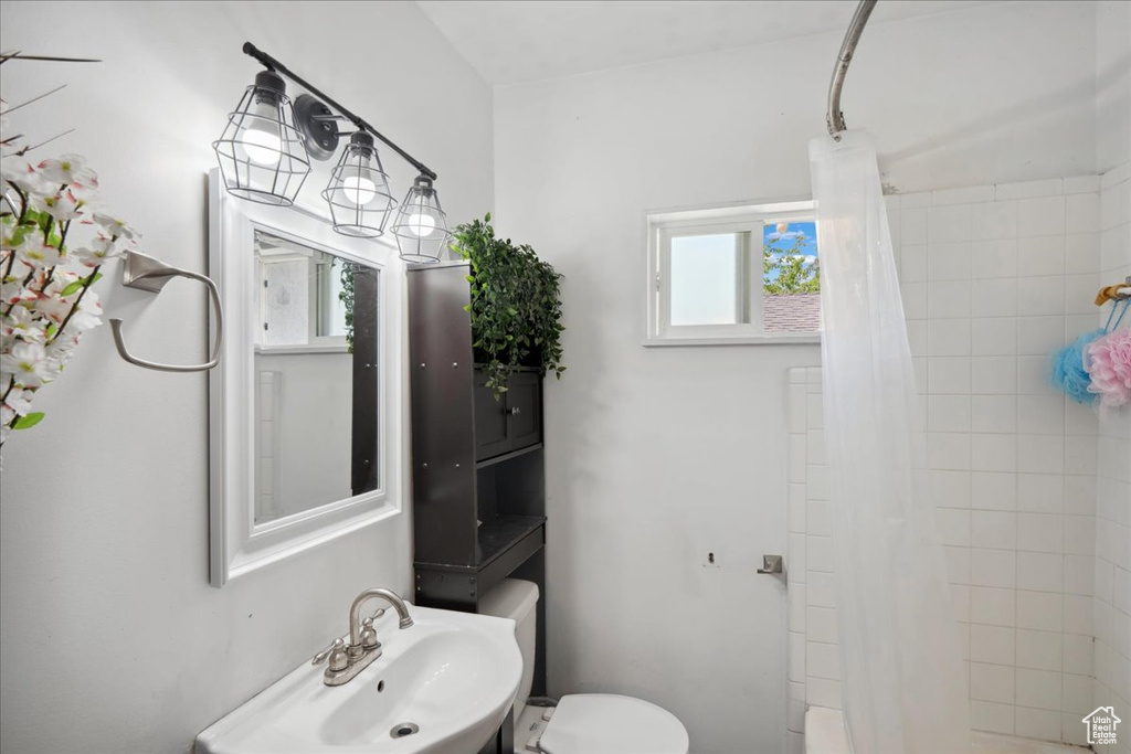 Full bathroom with a sink and toilet