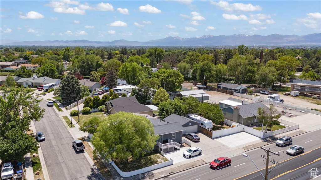 Aerial view of residential area featuring a mountainous background