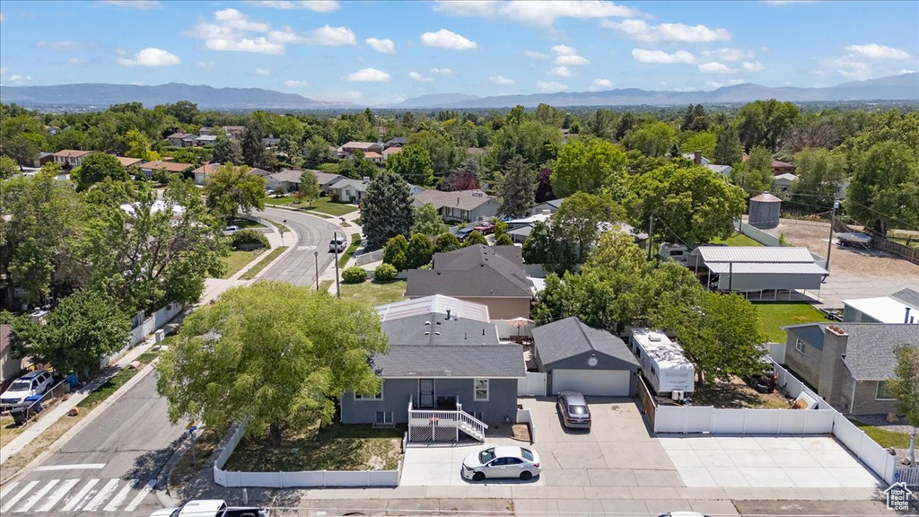 Aerial perspective of suburban area with a mountain backdrop