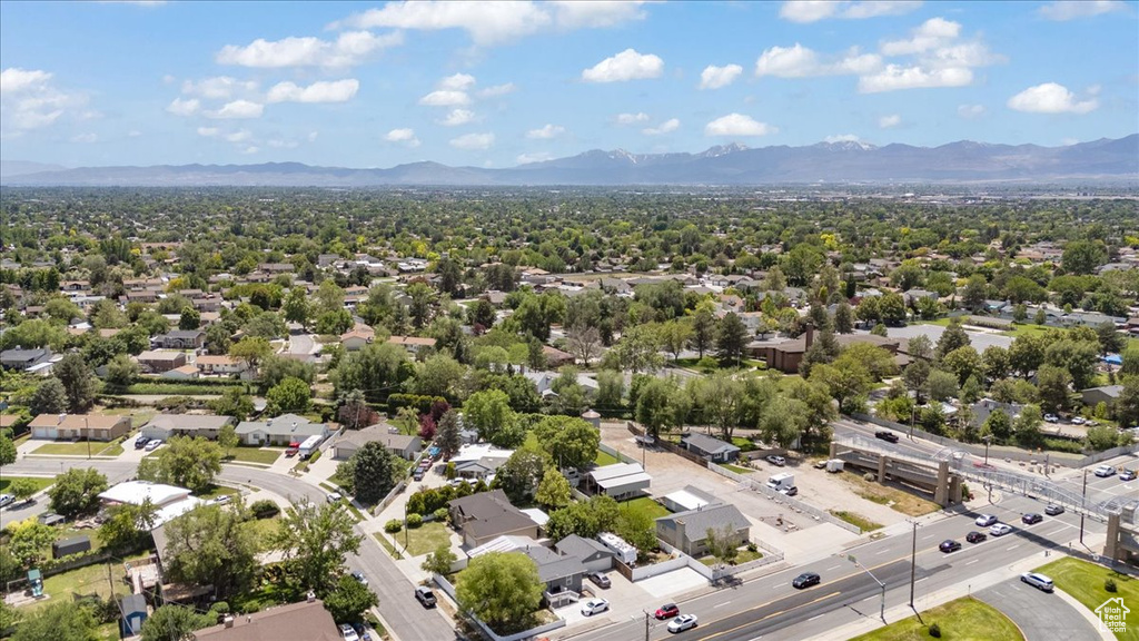 Aerial view of residential area featuring a mountain backdrop
