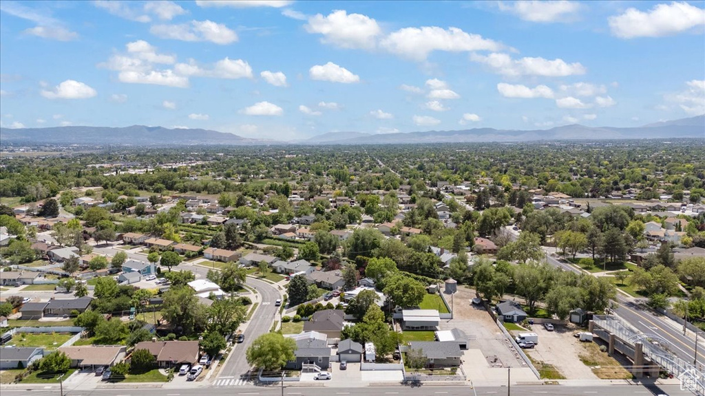 Aerial perspective of suburban area with a mountain backdrop