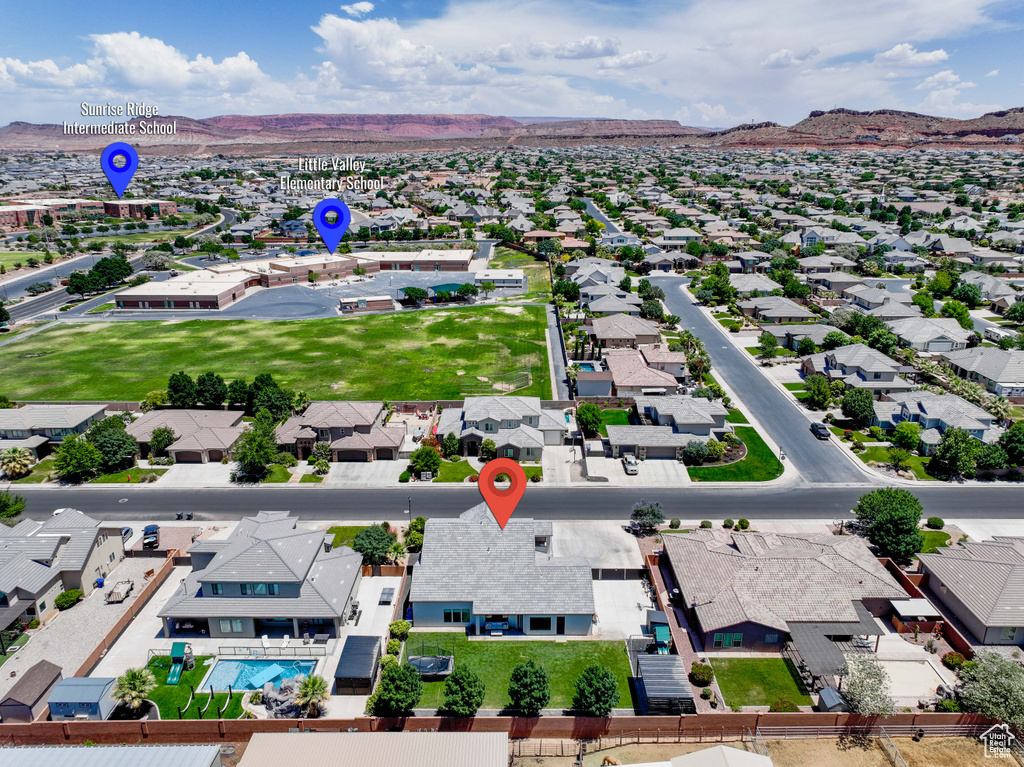 Aerial view of residential area with a mountainous background