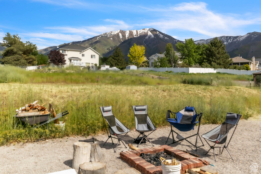 View of yard with a fire pit and a mountain view