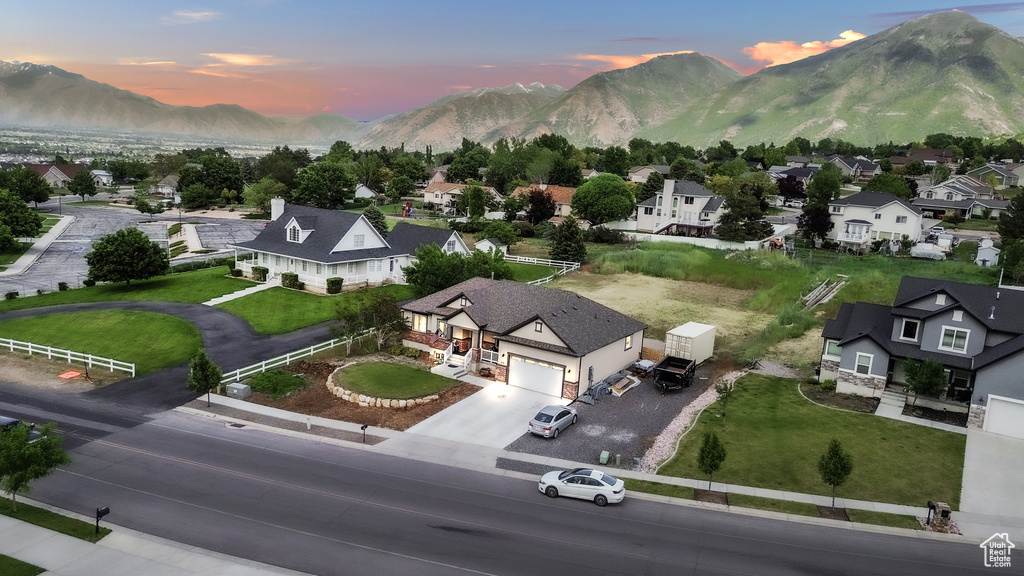 Aerial perspective of suburban area featuring a mountain backdrop