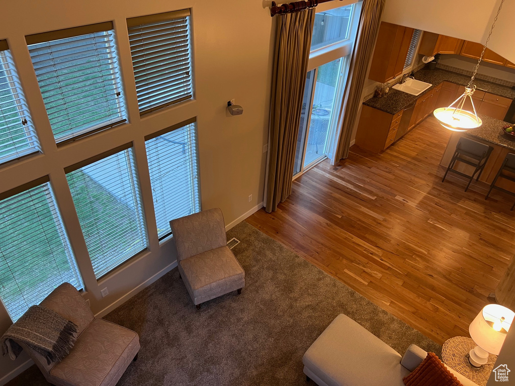 Living area with wood finished floors and baseboards