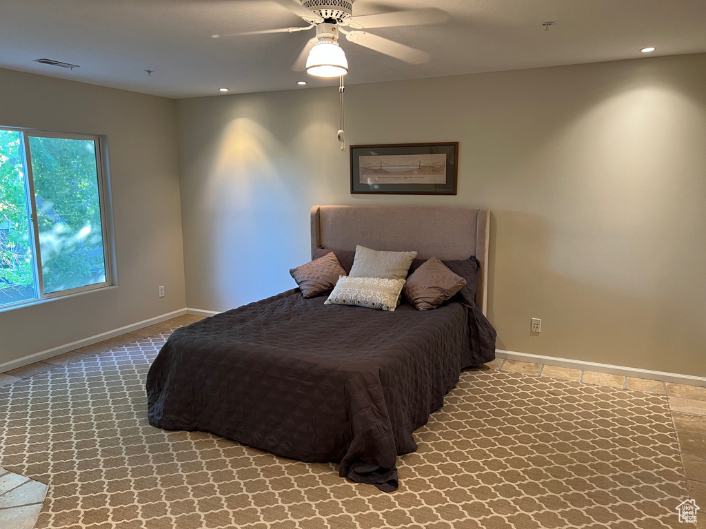 Carpeted bedroom with baseboards, recessed lighting, and ceiling fan