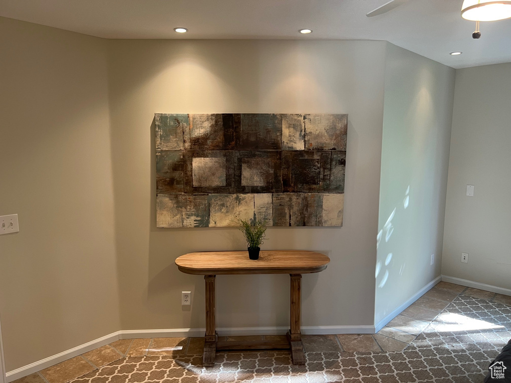 Detailed view of recessed lighting and baseboards