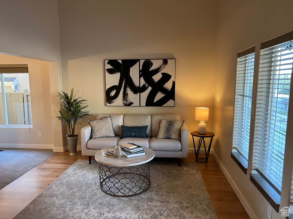 Living area with wood finished floors and baseboards