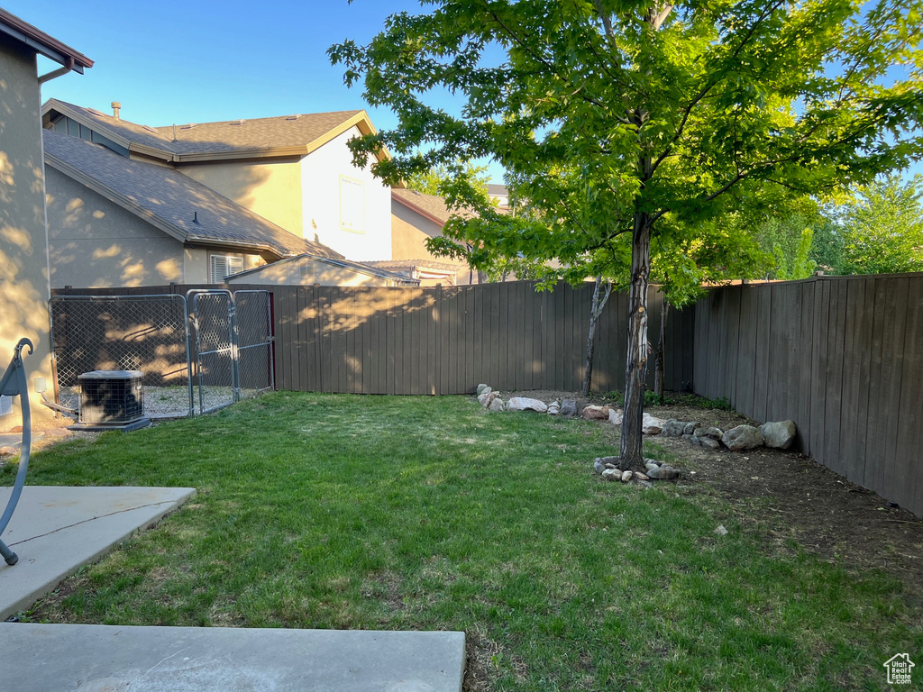 View of yard featuring central AC unit