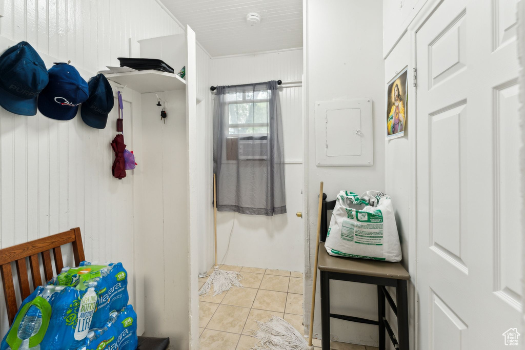 Bathroom featuring electric panel and tile patterned flooring