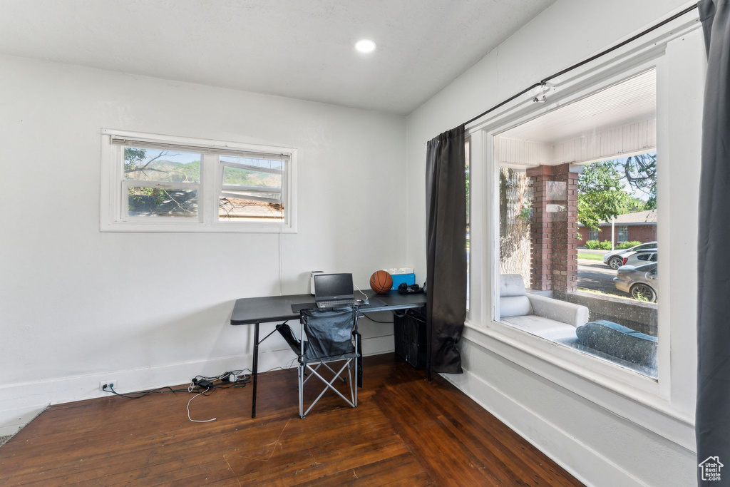 Home office featuring baseboards, dark wood finished floors, healthy amount of natural light, and recessed lighting
