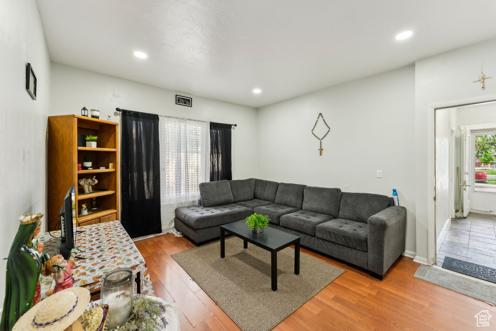 Living room featuring wood finished floors and recessed lighting