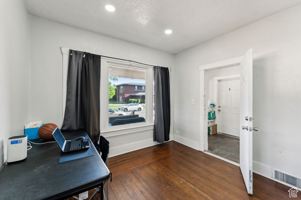 Home office featuring baseboards, hardwood / wood-style floors, and recessed lighting