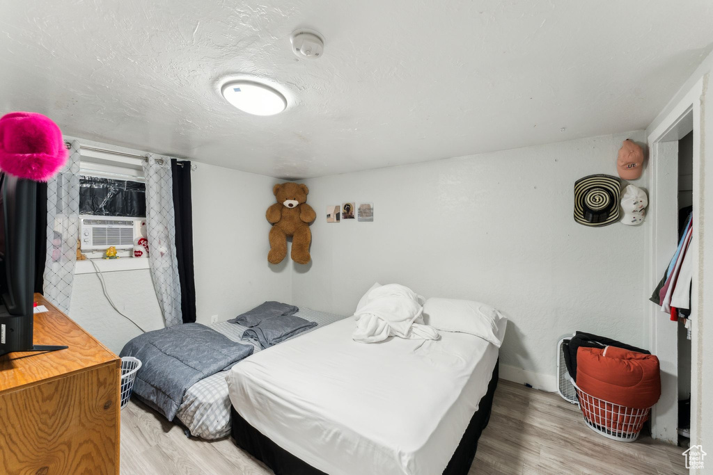 Bedroom with wood finished floors