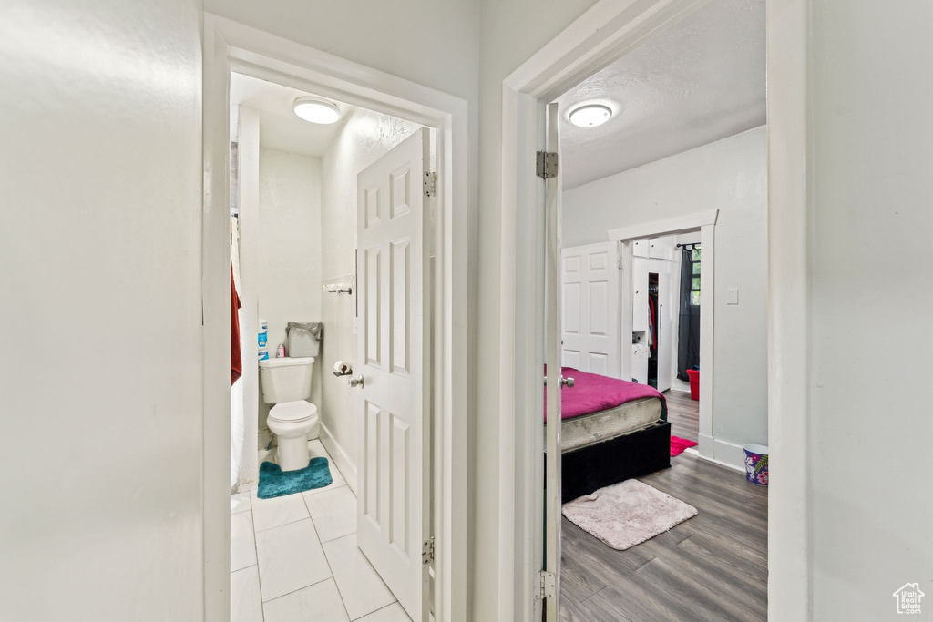 Hallway featuring tile patterned floors
