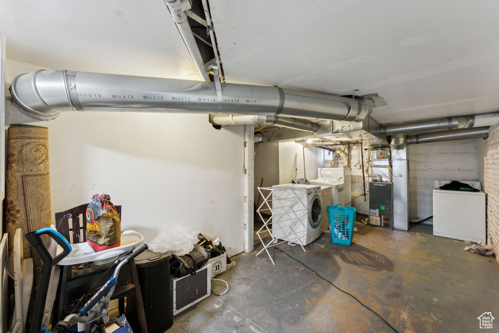 Unfinished below grade area featuring heating unit