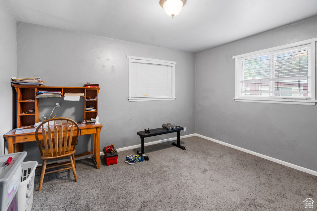 Office space with carpet flooring and baseboards