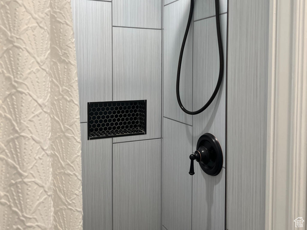 Full bathroom with tiled shower