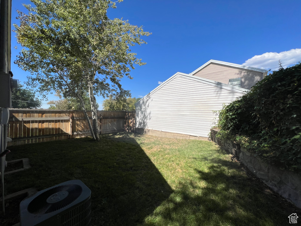 View of yard with central air condition unit