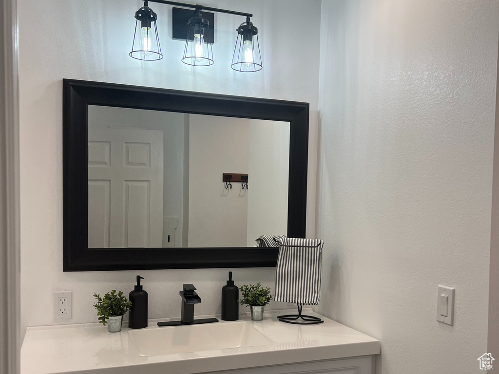 Bathroom with vanity and baseboards
