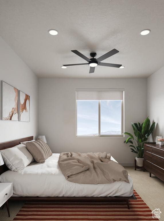 Carpeted bedroom with recessed lighting and a ceiling fan