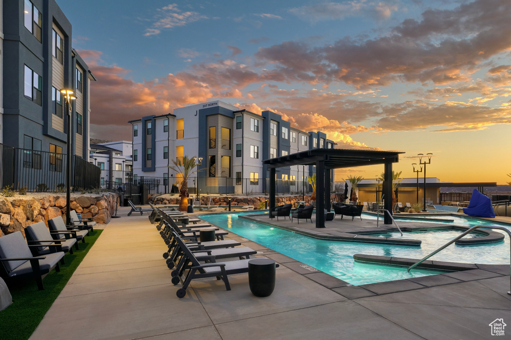 Community pool featuring a community hot tub and a patio area