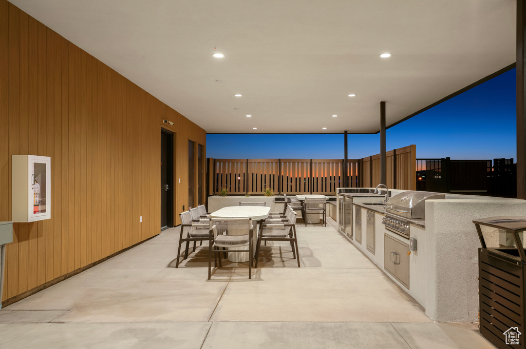 View of patio / terrace featuring outdoor dining area and a sink