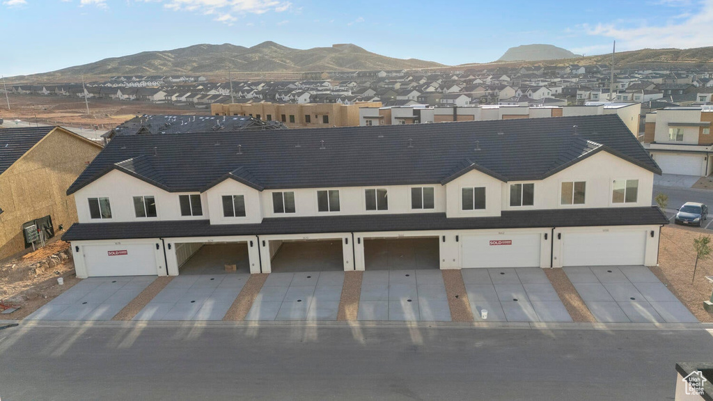 Aerial perspective of suburban area with a mountain backdrop