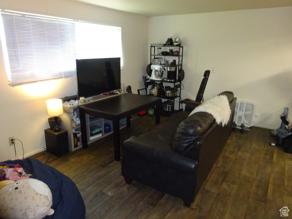 Living room featuring wood finished floors and baseboards