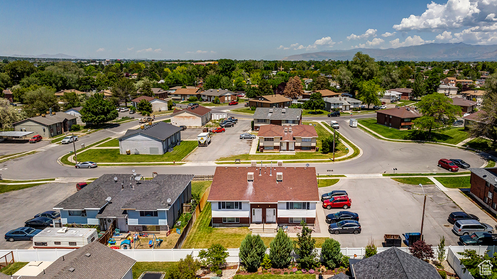 Aerial view of residential area with a mountainous background