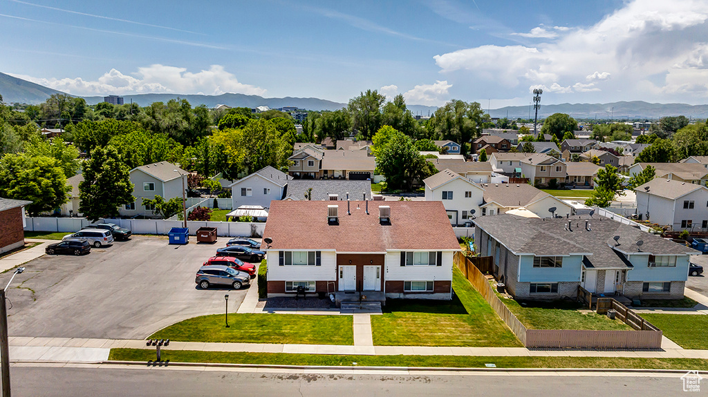 Aerial perspective of suburban area with a mountainous background