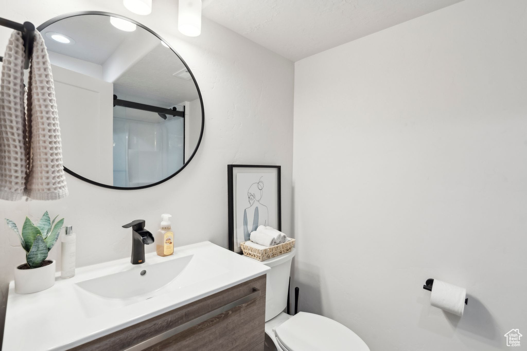 Bathroom with toilet and vanity