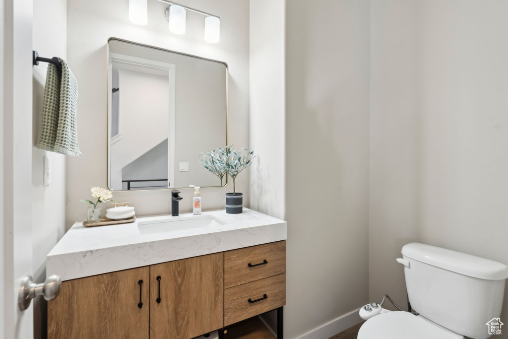 Half bath with toilet and vanity