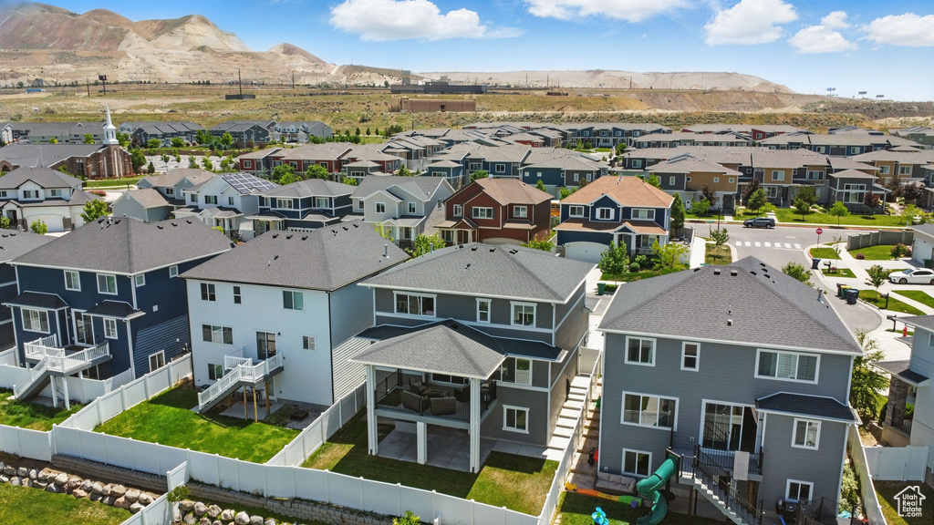 Aerial view of residential area featuring a mountainous background