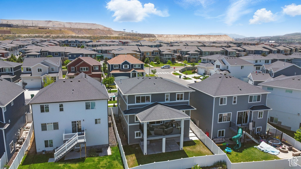 Aerial perspective of suburban area featuring a mountainous background