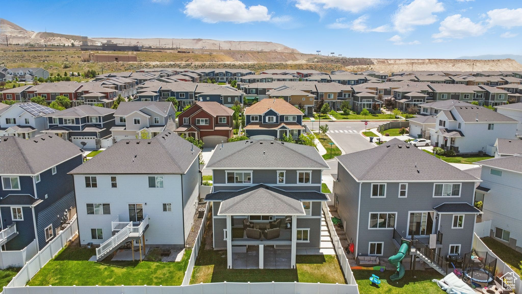 Aerial perspective of suburban area featuring a mountainous background