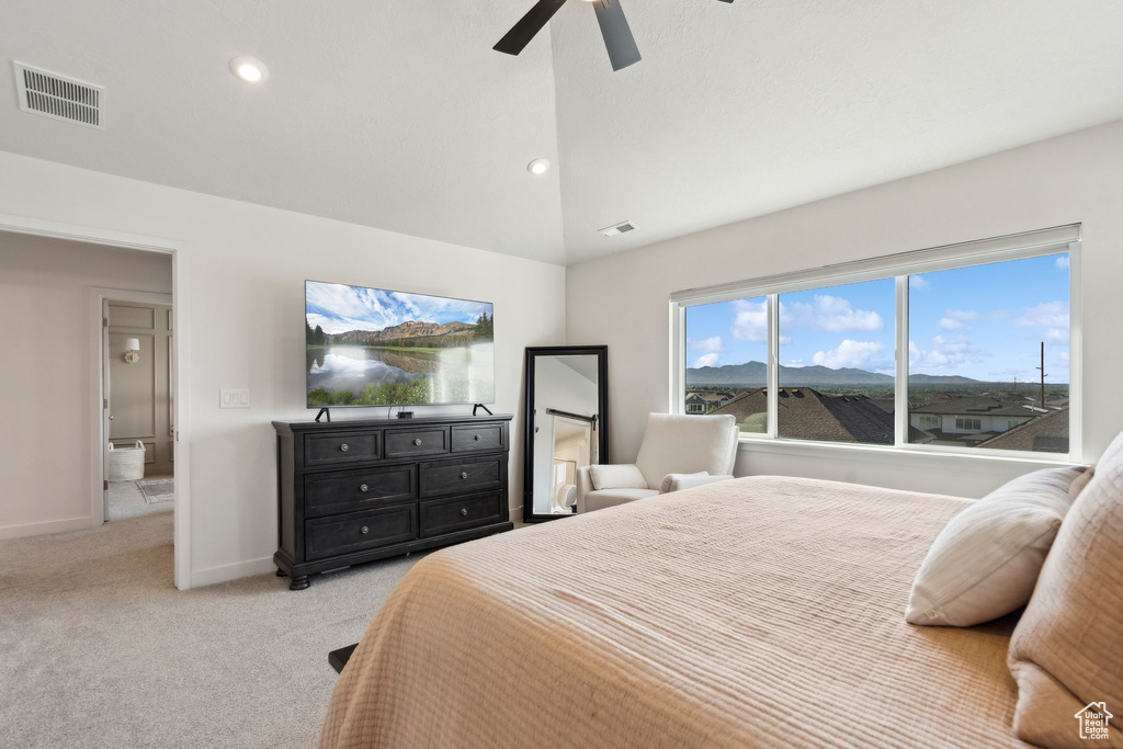 Bedroom with light carpet, vaulted ceiling, baseboards, ceiling fan, and recessed lighting