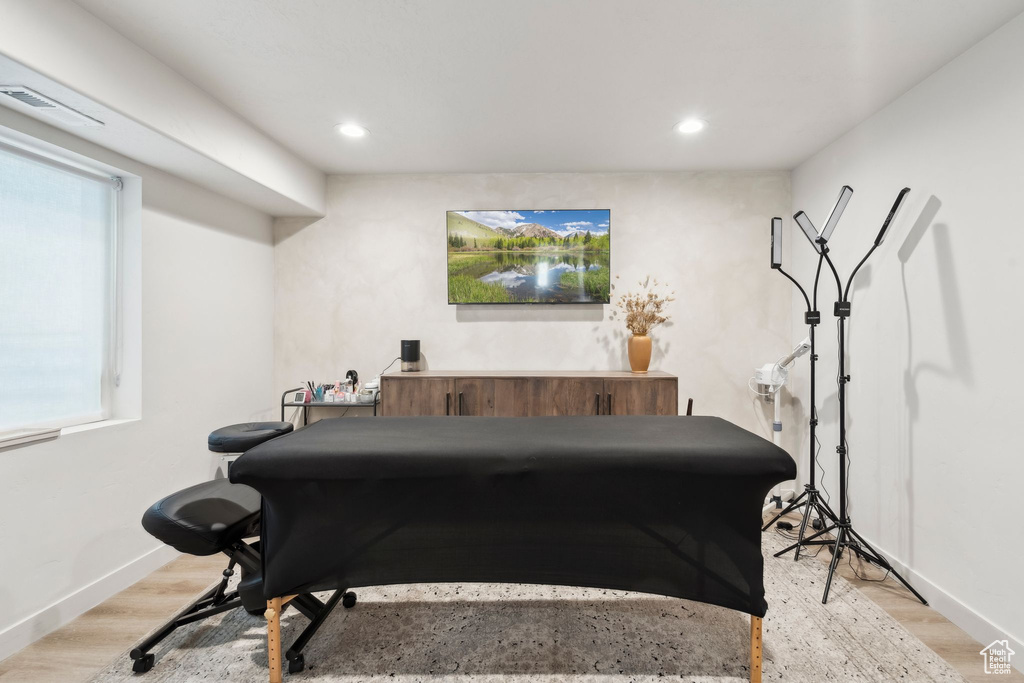 Recreation room with recessed lighting, light wood-type flooring, and baseboards