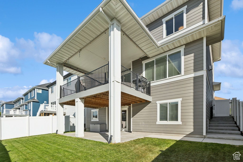 Rear view of house with a patio area