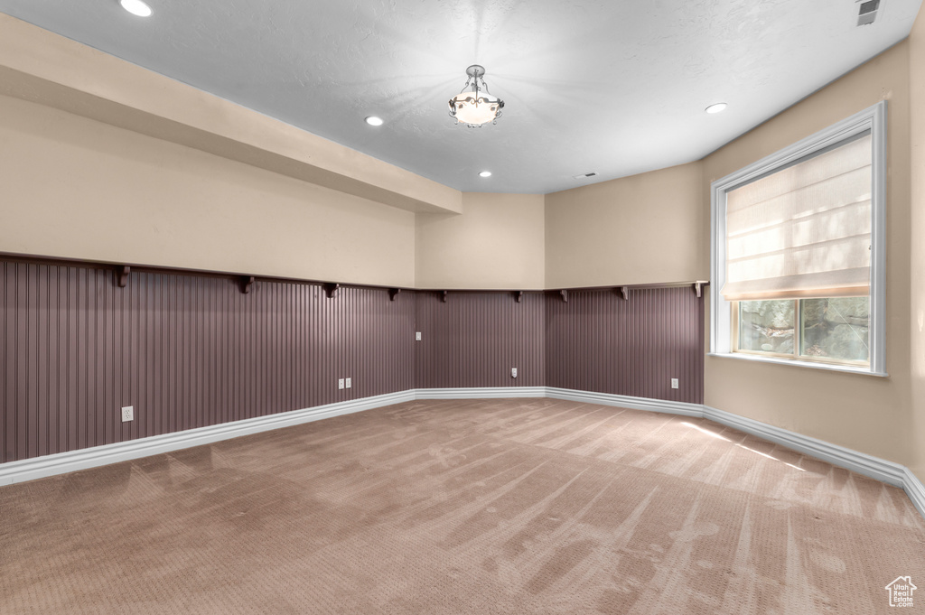 Spare room with carpet floors, recessed lighting, and baseboards