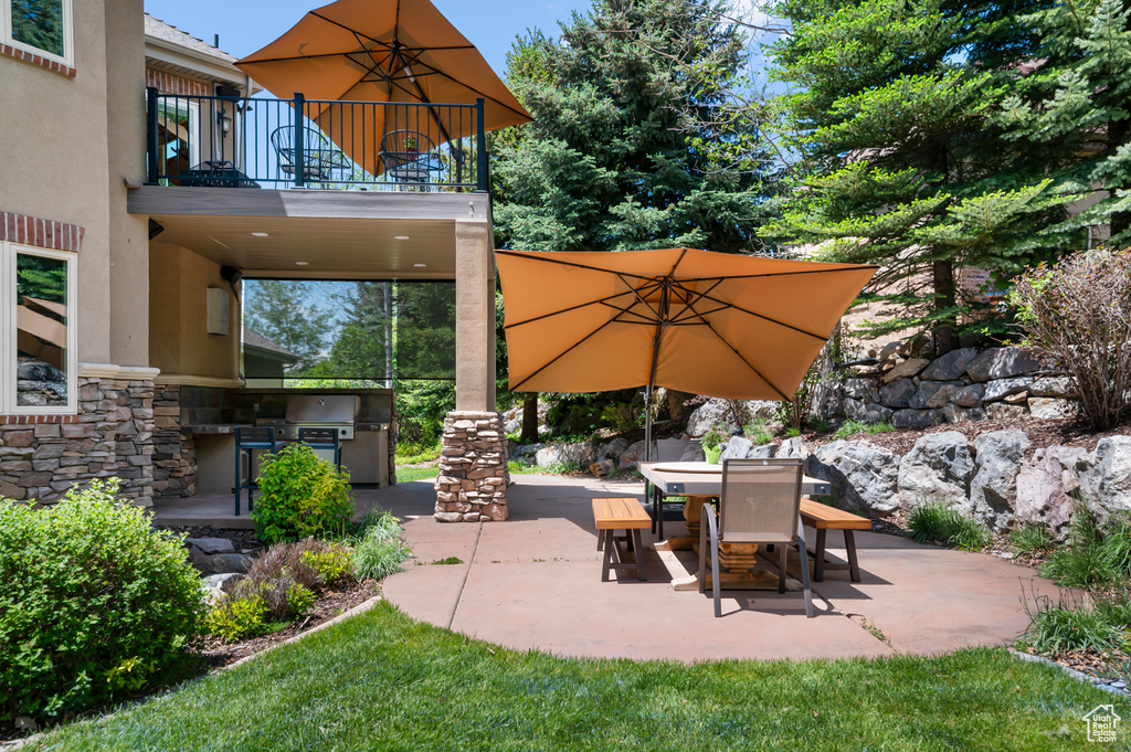 View of patio / terrace with a balcony, area for grilling, and outdoor dining area
