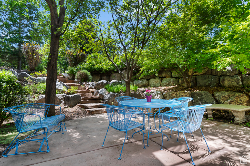 View of patio with outdoor dining area