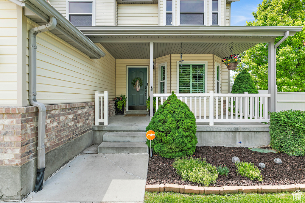 Property entrance featuring covered porch