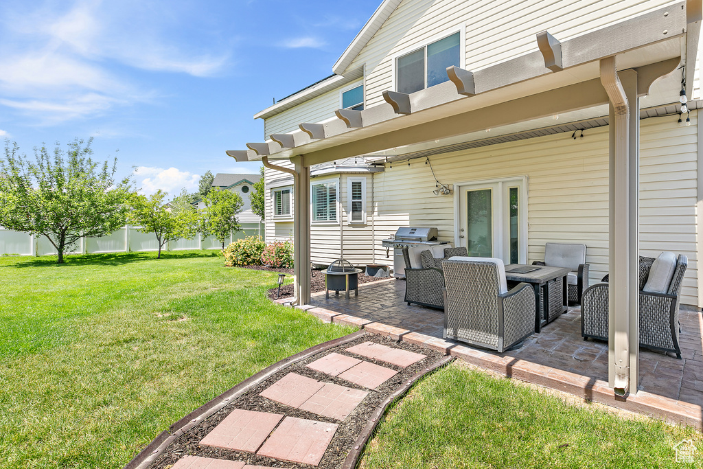 View of yard with a patio and an outdoor living space