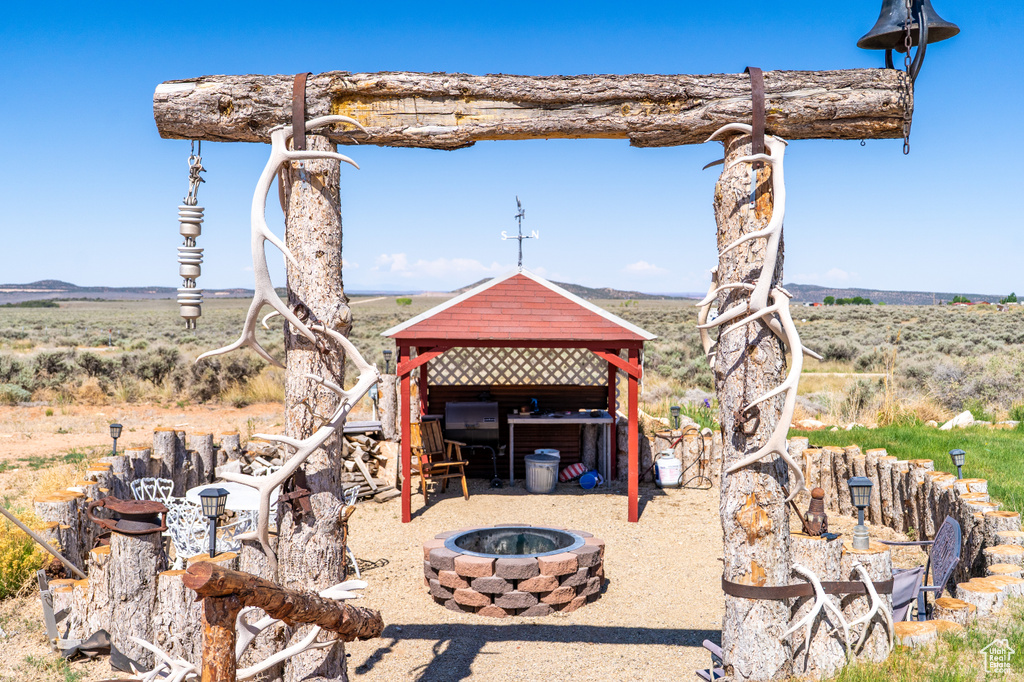 View of yard with a fire pit and a gazebo